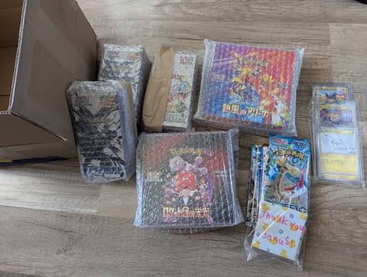Japanese sealed Pokémon product on workbench